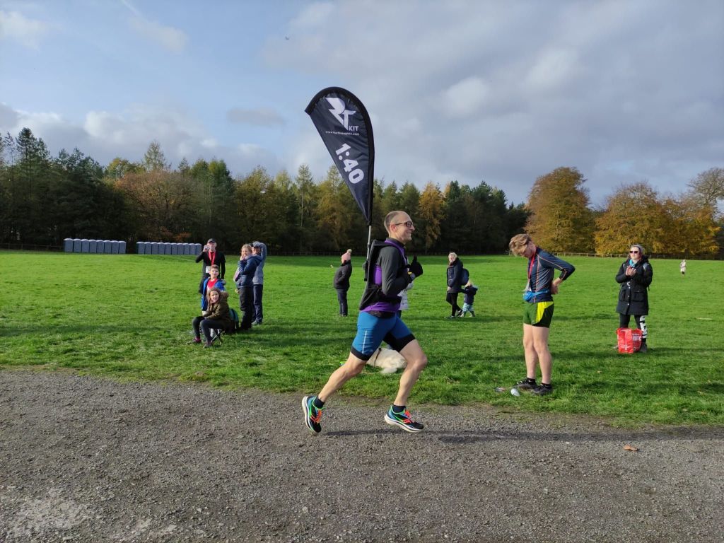 Alex running with a 1:40 pacer flag