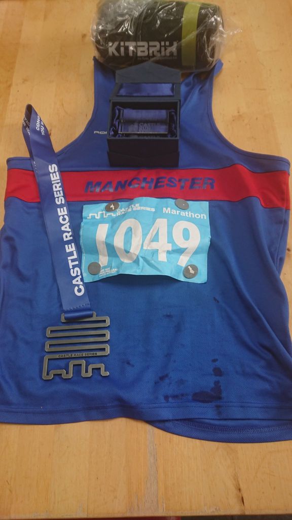 Race vest and prizes (medal, glass trophy and KitBrix bag) from Cholmondeley castle marathon